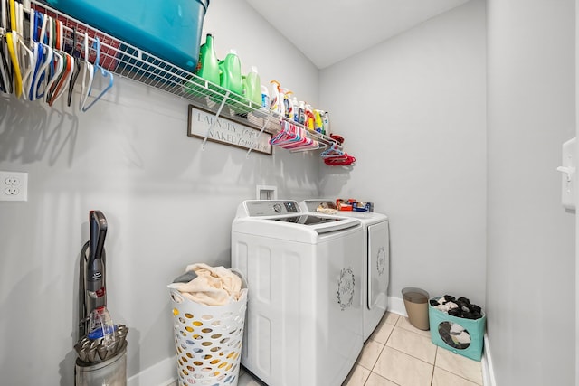 3204 Airport Rd, Panama City, FL 32405 - laundry area with washing machine and clothes dryer, baseboards, and light tile patterned floors