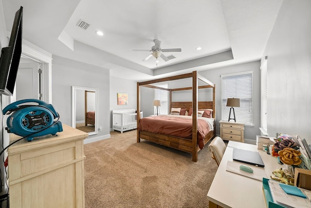 3204 Airport Rd, Panama City, FL 32405 - bedroom with light colored carpet, a raised ceiling, baseboards, recessed lighting, and a ceiling fan