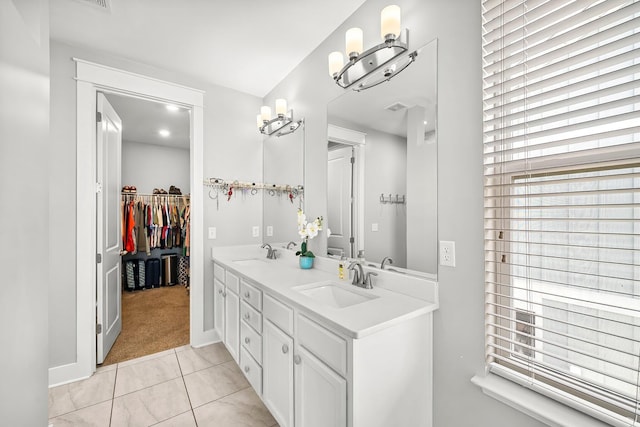 3204 Airport Rd, Panama City, FL 32405 - full bath with healthy amount of natural light, tile patterned floors, double vanity, and baseboards