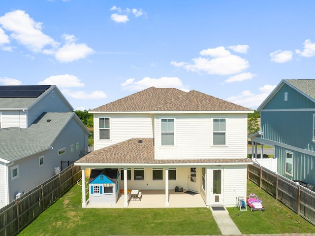 3204 Airport Rd, Panama City, FL 32405 - rear view of house with a shingled roof and a patio area