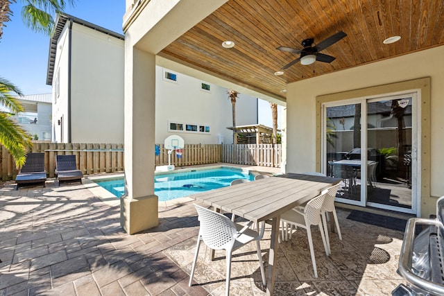 40 W Palm Beach Ct, Miramar Beach, FL 32550 - view of swimming pool featuring a patio area, a fenced backyard, a ceiling fan, and outdoor dining space