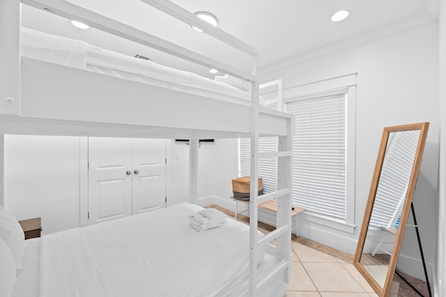 40 W Palm Beach Ct, Miramar Beach, FL 32550 - bedroom with light tile patterned floors, crown molding, recessed lighting, and baseboards