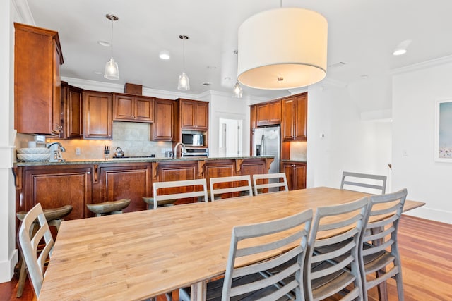 40 W Palm Beach Ct, Miramar Beach, FL 32550 - dining space with ornamental molding, light wood finished floors, and recessed lighting