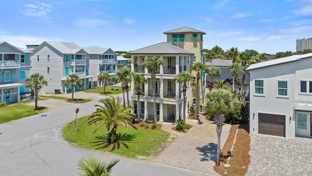 40 W Palm Beach Ct, Miramar Beach, FL 32550 - view of building exterior with decorative driveway, a garage, and a residential view