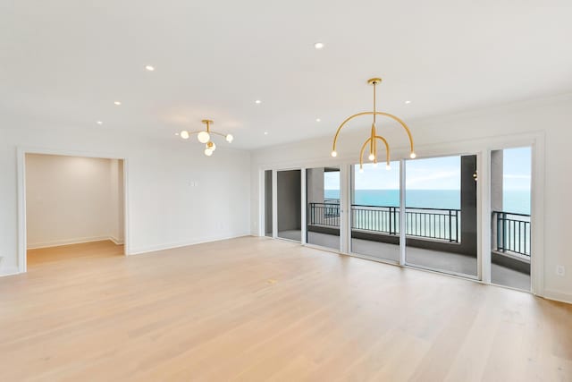 4629 Southwinds Dr Unit 4629, Miramar Beach, FL 32550 - unfurnished room featuring light wood finished floors, a chandelier, baseboards, recessed lighting, and a water view