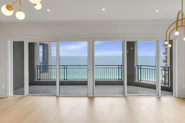 4629 Southwinds Dr Unit 4629, Miramar Beach, FL 32550 - unfurnished room featuring wood finished floors, crown molding, and a water view