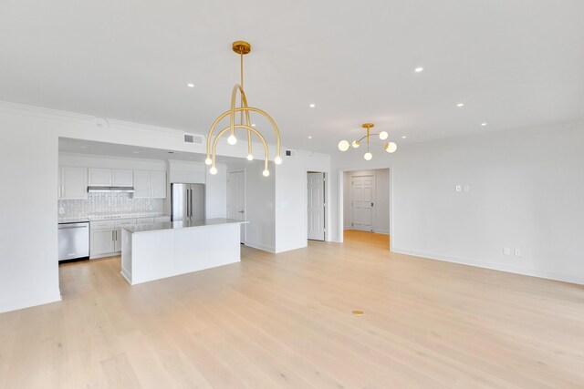 4629 Southwinds Dr Unit 4629, Miramar Beach, FL 32550 - unfurnished living room featuring light wood-type flooring, recessed lighting, baseboards, crown molding, and a chandelier