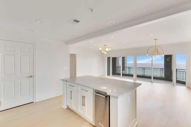 4629 Southwinds Dr Unit 4629, Miramar Beach, FL 32550 - kitchen featuring light wood finished floors, white cabinets, light stone counters, plenty of natural light, and ornamental molding