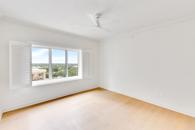 4629 Southwinds Dr Unit 4629, Miramar Beach, FL 32550 - spare room featuring light wood-style flooring, crown molding, ceiling fan, and baseboards