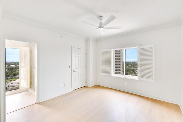 4629 Southwinds Dr Unit 4629, Miramar Beach, FL 32550 - spare room featuring healthy amount of natural light, a ceiling fan, ornamental molding, baseboards, and light wood finished floors