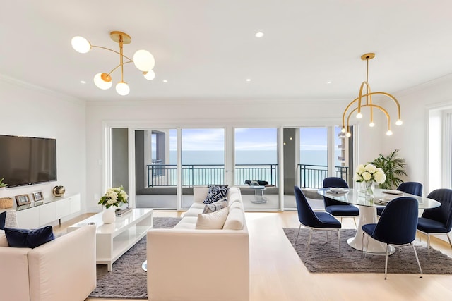 4629 Southwinds Dr Unit 4629, Miramar Beach, FL 32550 - living room with a chandelier, healthy amount of natural light, wood finished floors, a water view, and ornamental molding