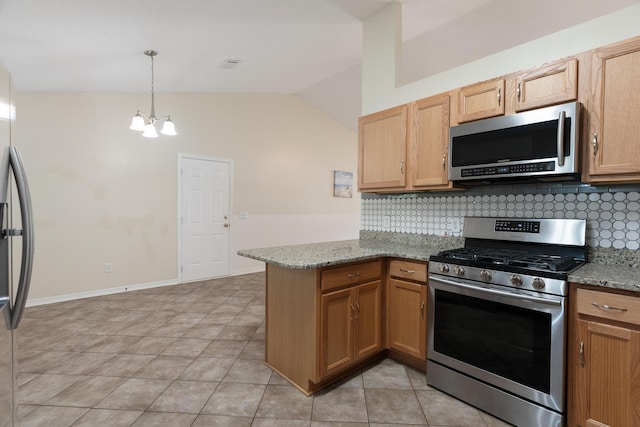 105 Steeplechase Dr, Crestview, FL 32539 - kitchen with appliances with stainless steel finishes, lofted ceiling, a peninsula, backsplash, and a chandelier