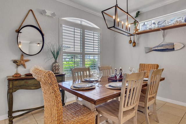 35 Opal Cv, Miramar Beach, FL 32550 - dining room with ornamental molding, light tile patterned floors, baseboards, and a chandelier