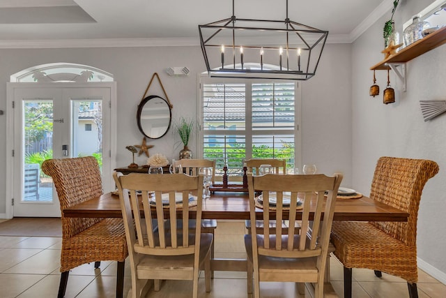35 Opal Cv, Miramar Beach, FL 32550 - dining space featuring light tile patterned floors, crown molding, baseboards, and a chandelier
