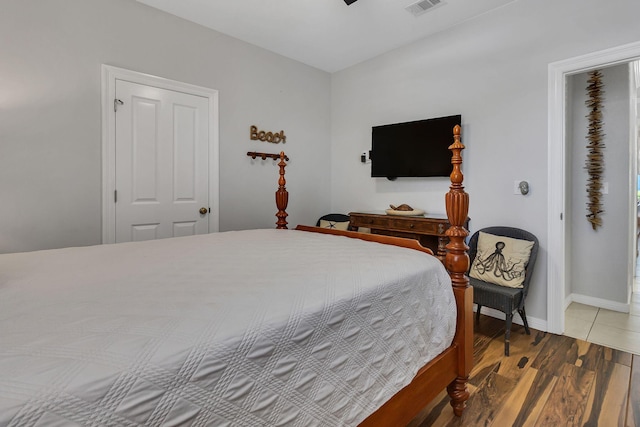 35 Opal Cv, Miramar Beach, FL 32550 - bedroom featuring wood finished floors, baseboards, and ceiling fan