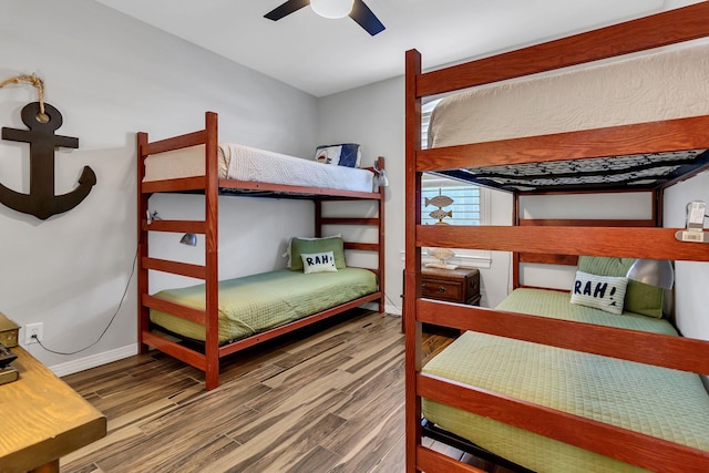 35 Opal Cv, Miramar Beach, FL 32550 - bedroom featuring wood finished floors, a ceiling fan, and baseboards