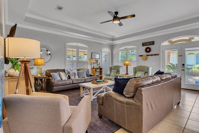 35 Opal Cv, Miramar Beach, FL 32550 - living room with healthy amount of natural light, a ceiling fan, a raised ceiling, and ornamental molding