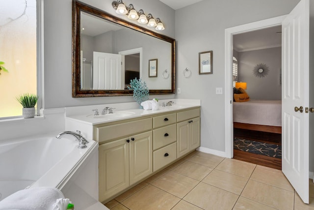 35 Opal Cv, Miramar Beach, FL 32550 - full bathroom featuring connected bathroom, tile patterned floors, a garden tub, and double vanity