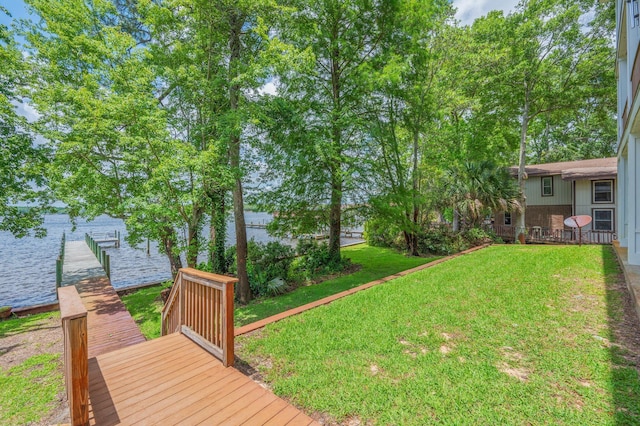 1405 N Bayshore Dr, Niceville, FL 32578 - view of grassy yard featuring a boat dock and a water view