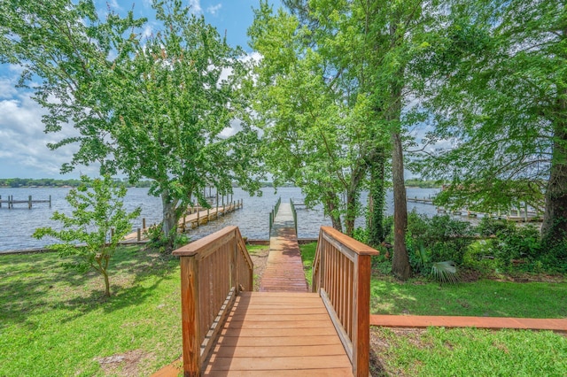 1405 N Bayshore Dr, Niceville, FL 32578 - view of property's community featuring a water view, a dock, and a lawn