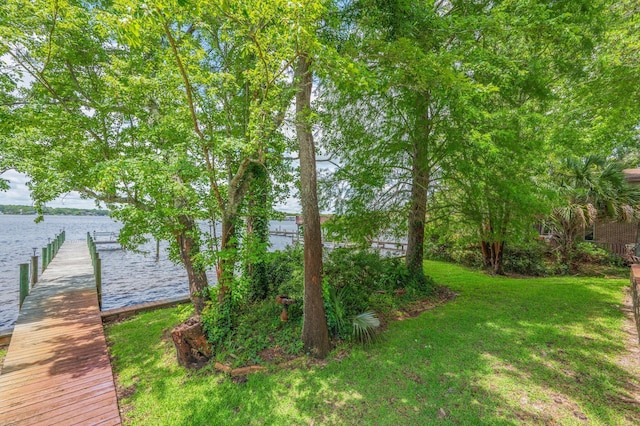 1405 N Bayshore Dr, Niceville, FL 32578 - view of green lawn featuring a water view and a boat dock