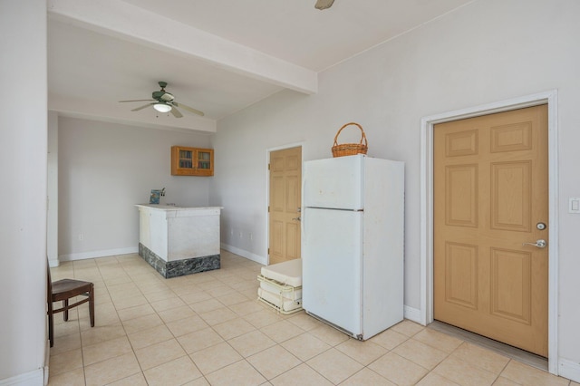 1405 N Bayshore Dr, Niceville, FL 32578 - kitchen featuring freestanding refrigerator, a ceiling fan, light tile patterned floors, beamed ceiling, and baseboards
