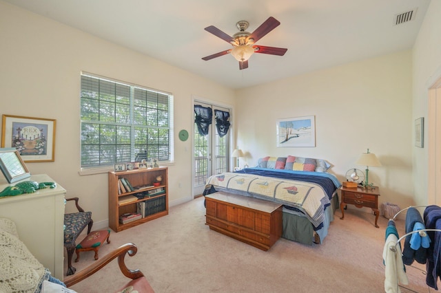 1405 N Bayshore Dr, Niceville, FL 32578 - carpeted bedroom with access to exterior, a ceiling fan, and baseboards