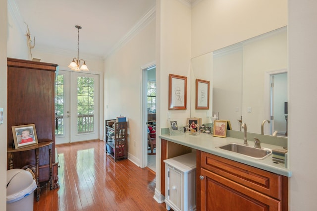 1405 N Bayshore Dr, Niceville, FL 32578 - bathroom with ornamental molding, vanity, wood-type flooring, a chandelier, and french doors