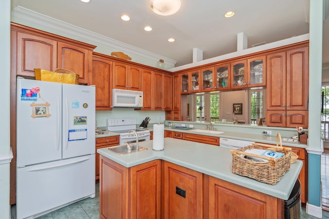 1405 N Bayshore Dr, Niceville, FL 32578 - kitchen featuring white appliances, light countertops, recessed lighting, an island with sink, and glass insert cabinets