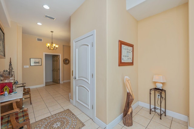 1405 N Bayshore Dr, Niceville, FL 32578 - entrance foyer with light tile patterned floors, a chandelier, recessed lighting, and baseboards