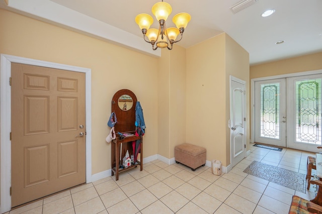 1405 N Bayshore Dr, Niceville, FL 32578 - foyer entrance featuring french doors, a chandelier, light tile patterned floors, baseboards, and recessed lighting