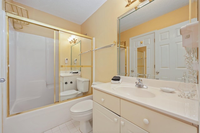 144 Spires Ln Unit 403, Santa Rosa Beach, FL 32459 - bathroom featuring toilet, tile patterned floors, vanity, a textured ceiling, and combined bath / shower with glass door