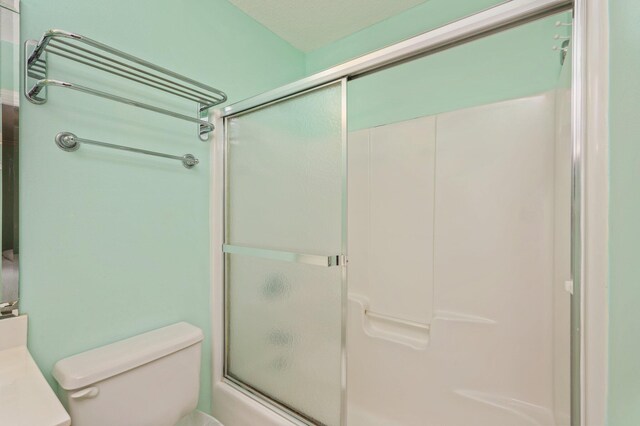 144 Spires Ln Unit 403, Santa Rosa Beach, FL 32459 - full bath featuring toilet, bath / shower combo with glass door, and vanity