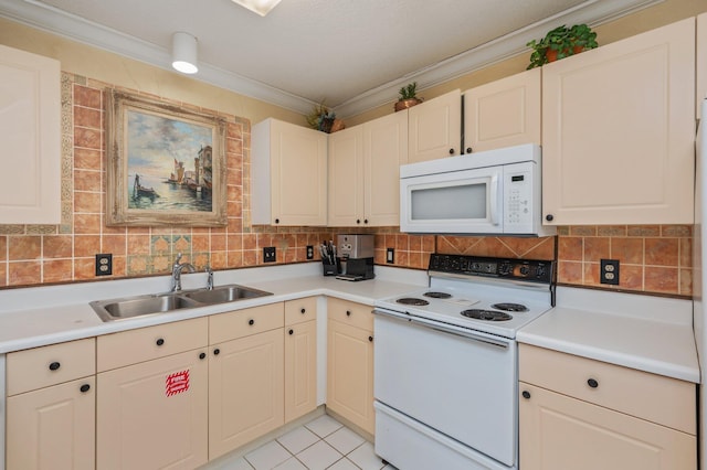 144 Spires Ln Unit 403, Santa Rosa Beach, FL 32459 - kitchen with white appliances, a sink, light countertops, tasteful backsplash, and crown molding
