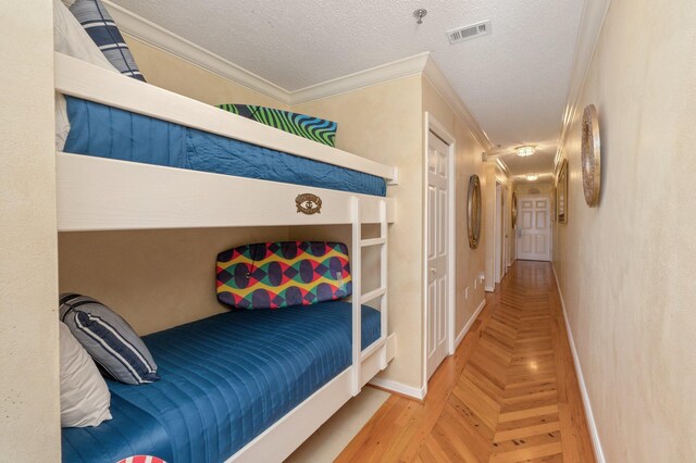 144 Spires Ln Unit 403, Santa Rosa Beach, FL 32459 - bedroom featuring ornamental molding, baseboards, and a textured ceiling
