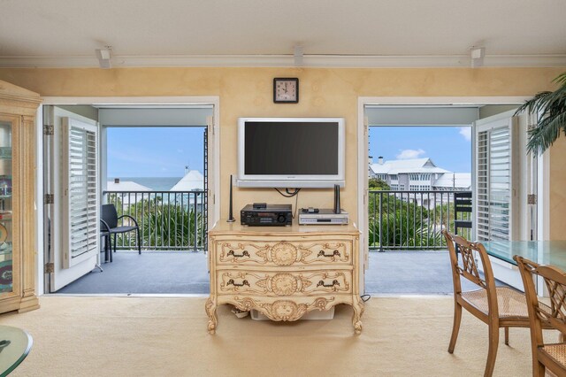 144 Spires Ln Unit 403, Santa Rosa Beach, FL 32459 - carpeted living area featuring ornamental molding