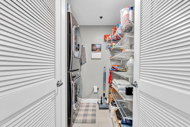 122 Seascape Dr Unit 1104, Miramar Beach, FL 32550 - laundry room with stacked washer / dryer and baseboards