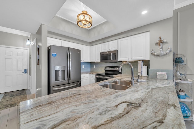 122 Seascape Dr Unit 1104, Miramar Beach, FL 32550 - kitchen featuring stainless steel appliances, light stone countertops, a sink, white cabinetry, and recessed lighting
