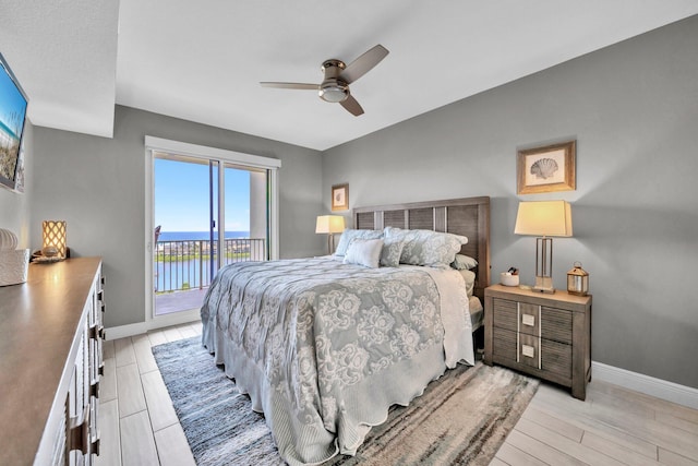 122 Seascape Dr Unit 1104, Miramar Beach, FL 32550 - bedroom featuring access to outside, baseboards, and light wood-type flooring