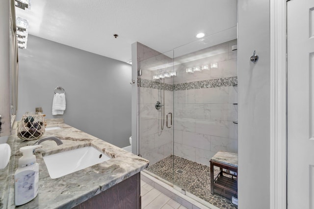 122 Seascape Dr Unit 1104, Miramar Beach, FL 32550 - bathroom featuring toilet, a shower stall, recessed lighting, and double vanity