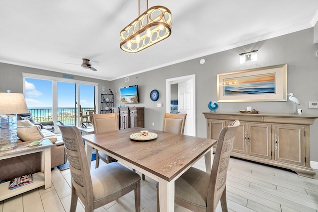 122 Seascape Dr Unit 1104, Miramar Beach, FL 32550 - dining space with crown molding and a ceiling fan