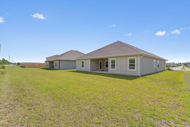 608 Champ Trl, Crestview, FL 32539 - back of property with a yard and board and batten siding