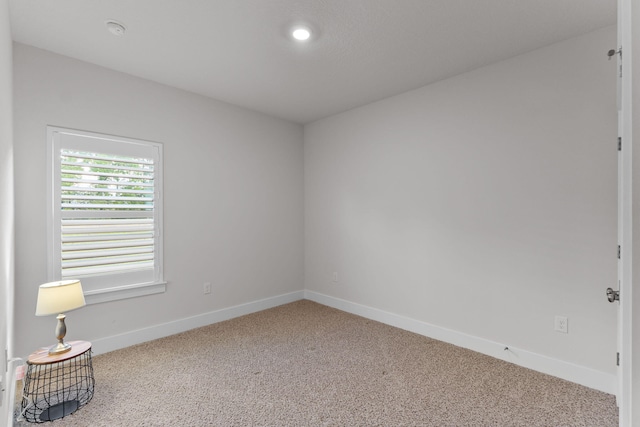 608 Champ Trl, Crestview, FL 32539 - carpeted spare room with baseboards, a smoke detector, and recessed lighting
