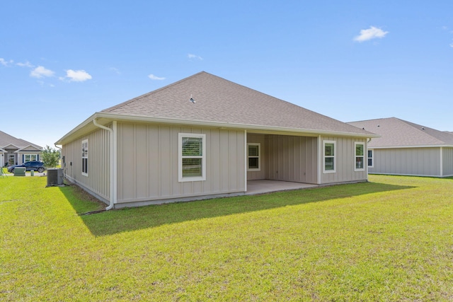 608 Champ Trl, Crestview, FL 32539 - rear view of property featuring cooling unit, a patio area, a lawn, and a shingled roof