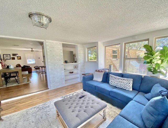 123 NW Sotir St, Fort Walton Beach, FL 32548 - living room featuring wood finished floors and a textured ceiling