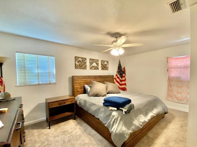 123 NW Sotir St, Fort Walton Beach, FL 32548 - carpeted bedroom featuring baseboards and a ceiling fan