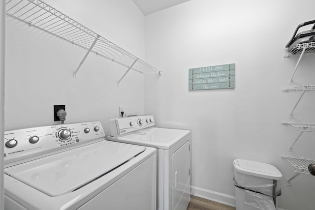 8512 Turnberry Ct Unit 8512, Miramar Beach, FL 32550 - laundry area with independent washer and dryer, baseboards, and wood finished floors