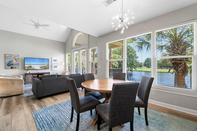 8512 Turnberry Ct Unit 8512, Miramar Beach, FL 32550 - dining room with light wood finished floors, a chandelier, high vaulted ceiling, baseboards, and ceiling fan