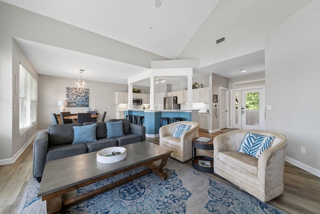 8512 Turnberry Ct Unit 8512, Miramar Beach, FL 32550 - living room with light wood-style flooring, baseboards, a chandelier, lofted ceiling, and ceiling fan