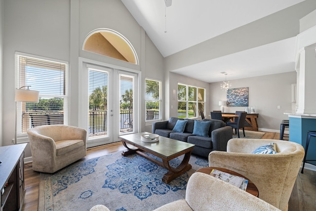 8512 Turnberry Ct Unit 8512, Miramar Beach, FL 32550 - living room with wood finished floors, a chandelier, high vaulted ceiling, baseboards, and ceiling fan
